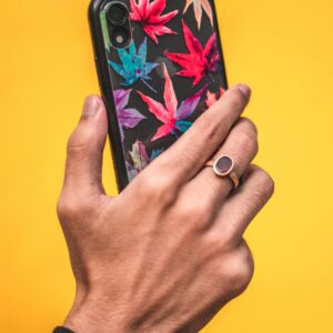 a hand holding a phone that is ready to be reviewed by Rate-Go, a company that embraces a customer first culture
